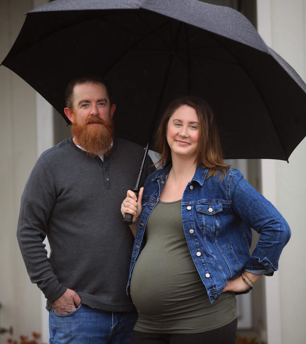 Brenna and Jim Paustenbach at their Rohnert Park home, Saturday, April 4, 2020, and are expecting their first child in the coming months, amid the COVID-19 pandemic. (Kent Porter / The Press Democrat) 2020