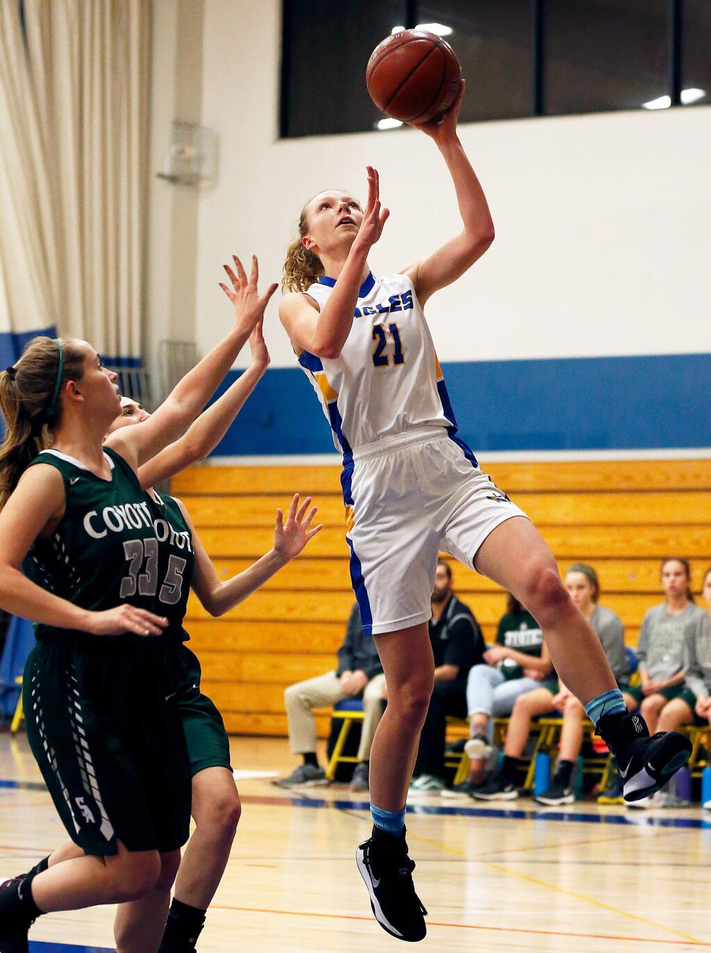 Rincon Valley Christian's Caroline Chambers (21), right, scores with a layup during the first half of a girls varsity basketball game between Sonoma Academy and Rincon Valley Christian high schools in Santa Rosa, California, on Thursday, January 17, 2019. (Alvin Jornada / The Press Democrat)