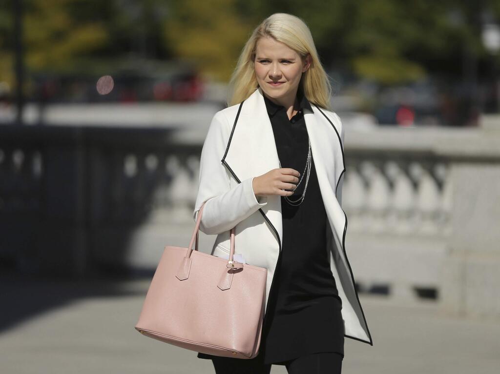 FILE - In this Sept. 13, 2018, file photo, Elizabeth Smart arrives for a news conference in Salt Lake City. Utah kidnapping and rape survivor Smart says she was sexually assaulted on an airplane last year. Smart said on 'CBS This Morning' Thursday, Feb. 6, 2020, that she was sleeping when she felt someone's hand rubbing her inner thigh. She says the last time someone touched her without permission was when she was kidnapped as a 14-year-old girl. (AP Photo/Rick Bowmer, File)