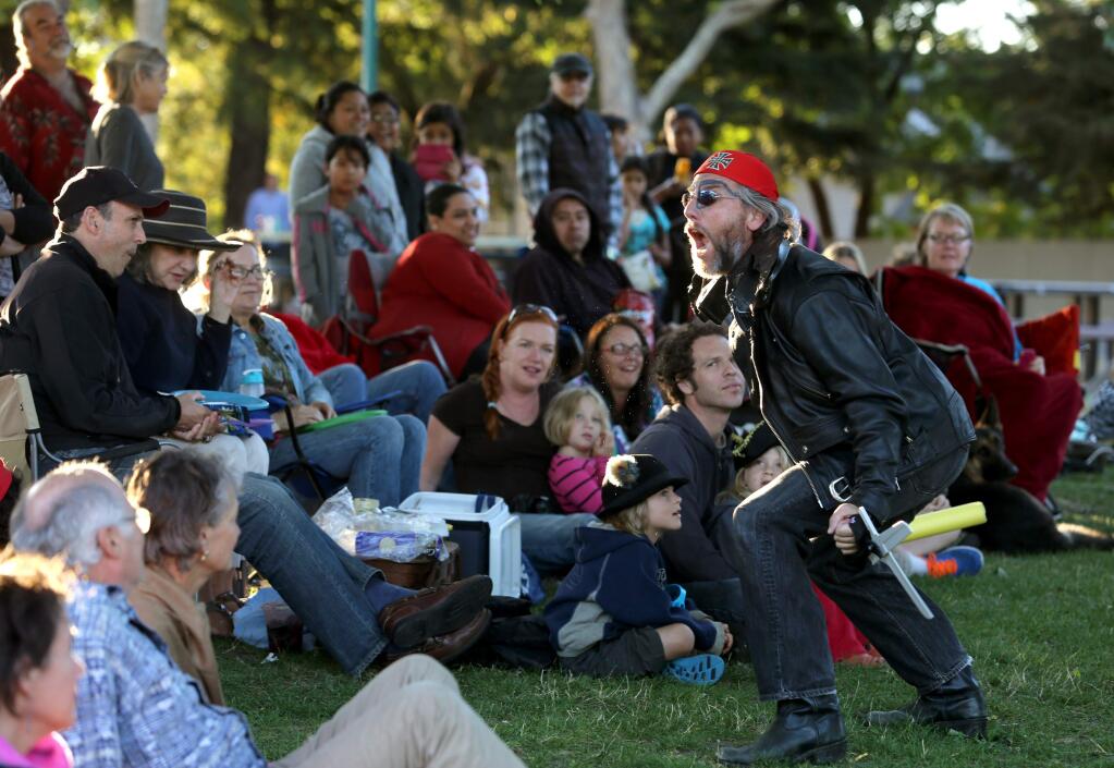 Brent Lindsay, executive director and co-founder of The Imaginists performs in The Butterfly's Evil Spell/ El Malefic de la Mariposa, a play by Federico Garcia Lorca to an audience at Martin Luther King, Jr. Park in Santa Rosa, Friday, July 24, 2015. (Crista Jeremiason / The Press Democrat)