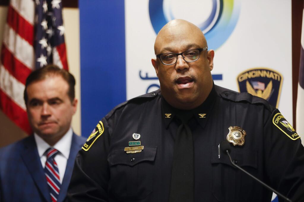 Cincinnati Police Chief Eliot Isaac, right, speaks alongside mayor John Cranley during a news conference at police headquarters regarding a fatal shooting at the Cameo club, Sunday, March 26, 2017, in Cincinnati. (AP Photo/John Minchillo)