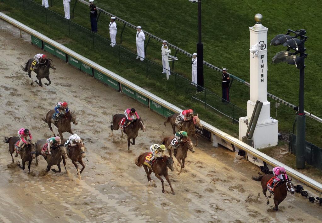 Luis Saez rides Maximum Security to the finish line first against Flavien Prat on Country House during the 145th running of the Kentucky Derby horse race at Churchill Downs Saturday, May 4, 2019, in Louisville, Ky. Country House was declared the winner after Maximum Security was disqualified following a review by race stewards. (AP Photo/Charlie Riedel)
