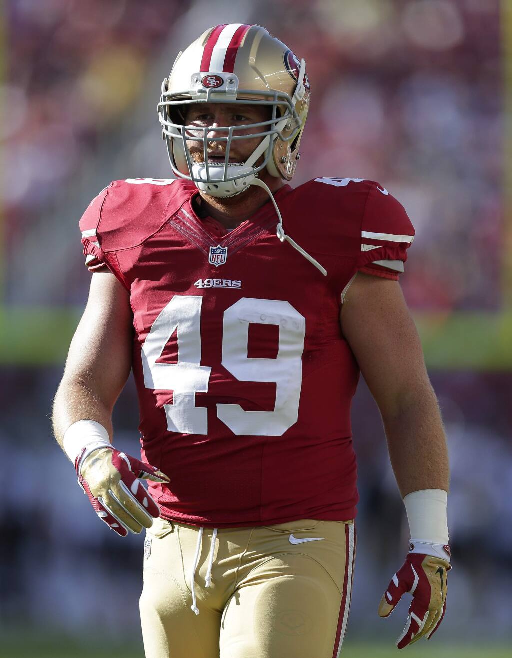 San Francisco 49ers fullback Bruce Miller (49) warms up before an NFL football game against the Chicago Bears in Santa Clara, Sunday, Sept. 14, 2014. (AP Photo/Marcio Jose Sanchez)