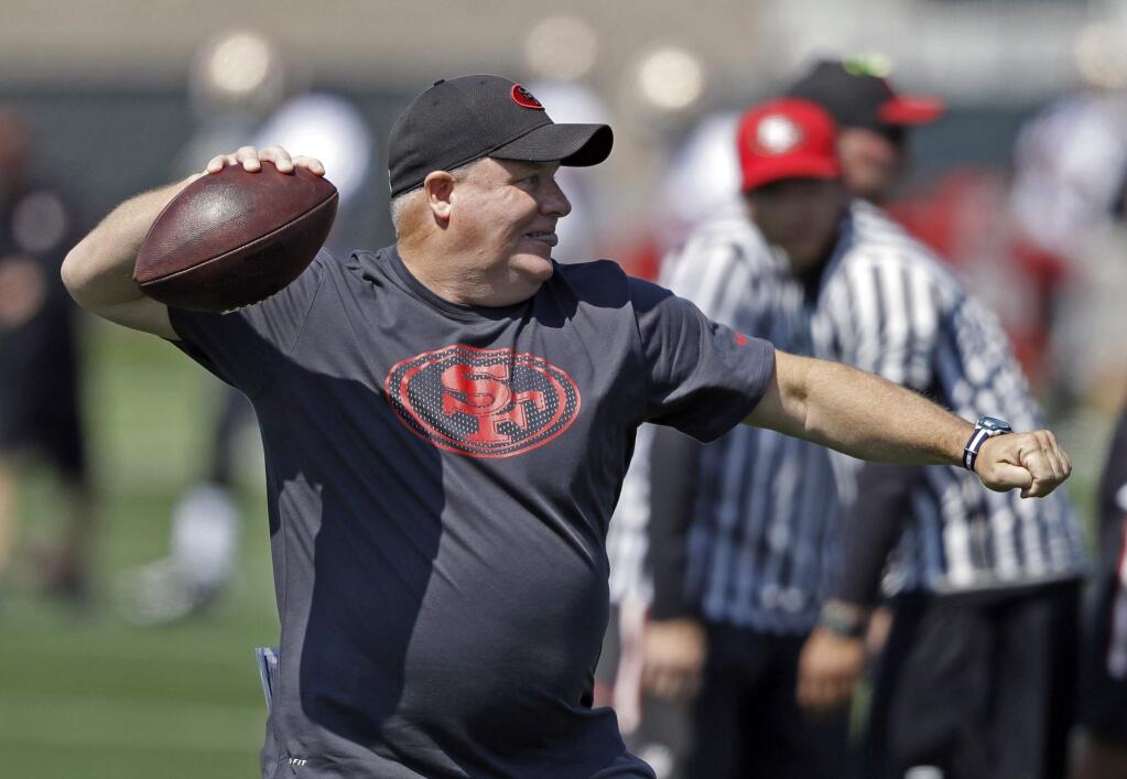 FILE - In this July 31, 2016, file photo, San Francisco 49ers head coach Chip Kelly during NFL football training camp in Santa Clara, Calif. After three straight trips to NFC championship game and one Super Bowl appearance under Jim Harbaugh from 2011-13, 49ers have fallen to bottom of NFC. Harbaugh was run out of town following 8-8 season in 2014 and team got worse under Tomsula. Now Kelly will try to turn Niners around in second head coaching job. (AP Photo/Marcio Jose Sanchez, File)