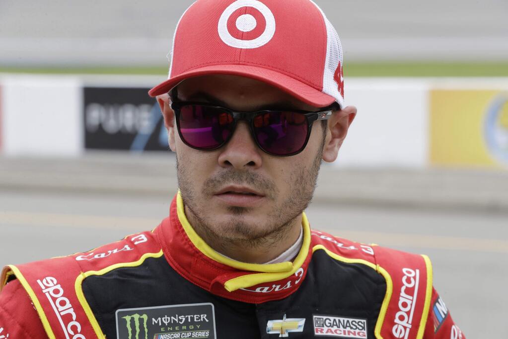 Kyle Larson looks on after qualifying, Friday, June 16, 2017, for the NASCAR Monster Energy Cup Series race in Brooklyn, Mich. (AP Photo/Carlos Osorio)
