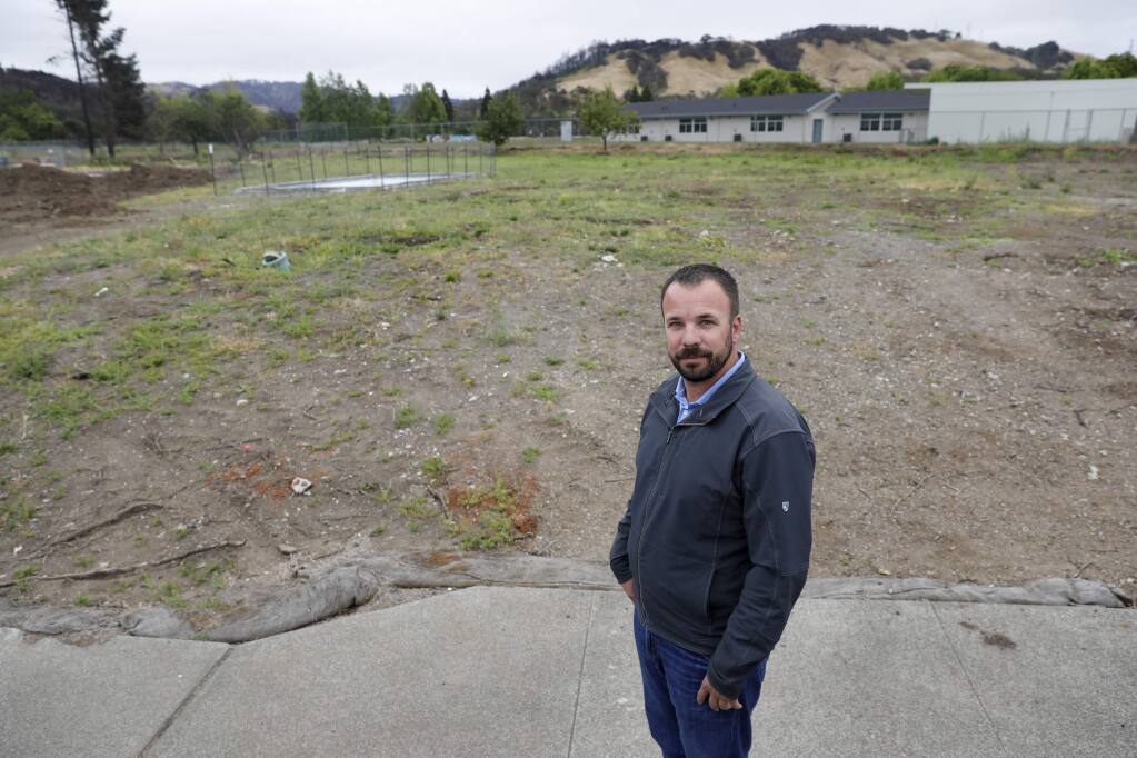 Nick Moen, 36, stands on his empty lot on Pacific Heights Drive in Mark West Estates after his home was destroyed by the Tubbs fire. Photo taken on Wednesday, May 23, 2018 in Larkfield, California . (BETH SCHLANKER/The Press Democrat)