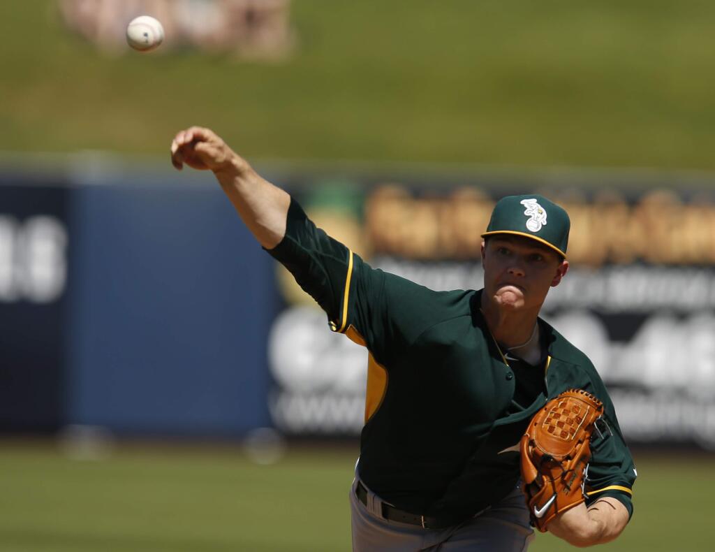Oakland Athletics starting pitcher Sonny Gray throws in the first inning of a spring training game against the Milwaukee Brewers, Wednesday, March 25, 2015, in Phoenix. (AP Photo/Rick Scuteri)