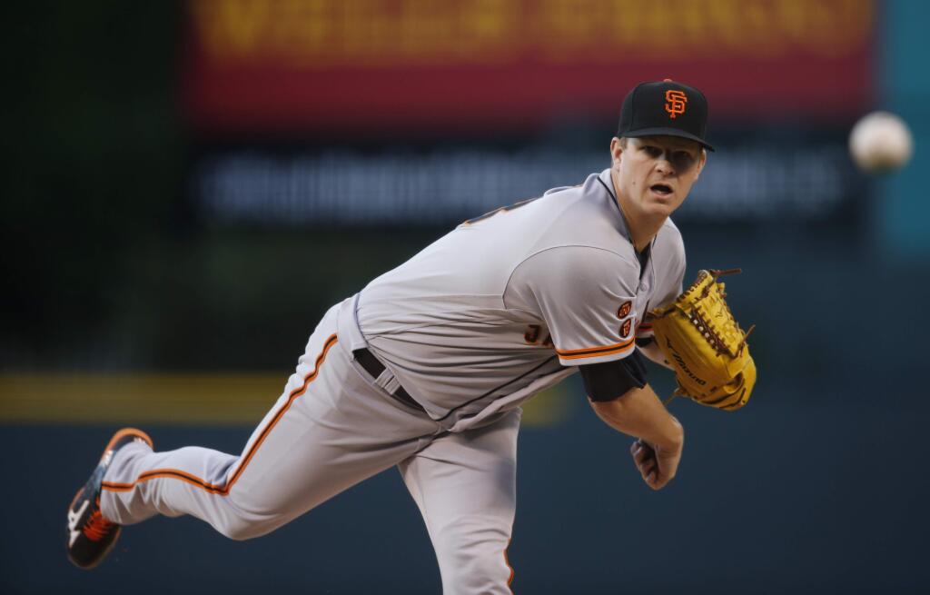 San Francisco Giants starting pitcher Matt Cain works against the Colorado Rockies in the first inning of a baseball game Friday, May 27, 2016, in Denver. (AP Photo/David Zalubowski)