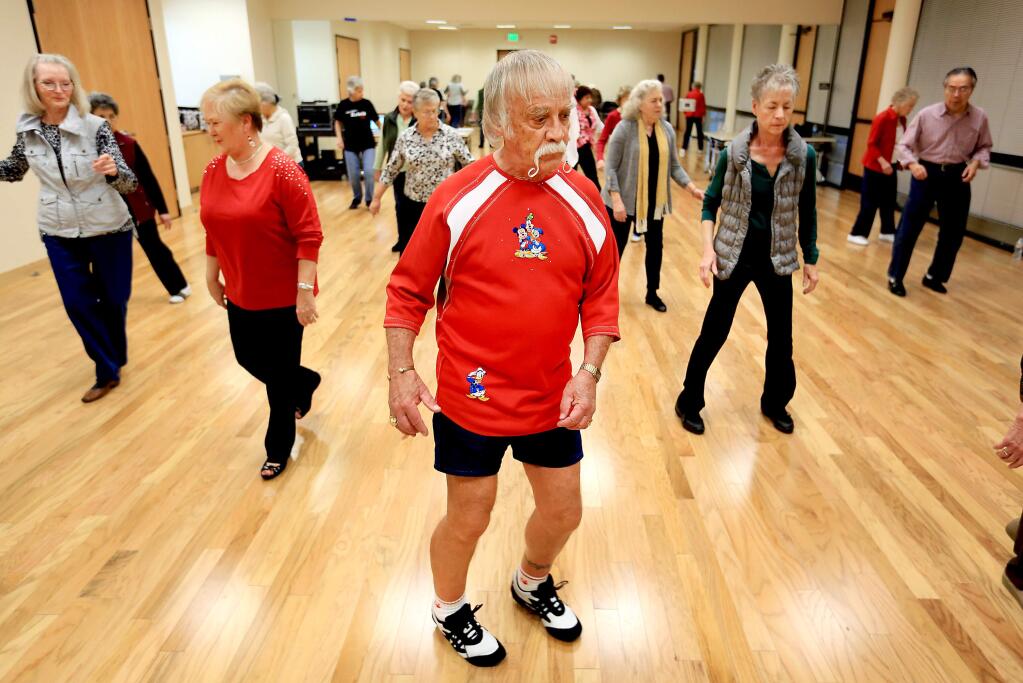 Sonoma County is discussing ways to assist the growing senior citizens committee on a number of fronts including transportation and activities, such as this line dance class at the Person Senior Center in Santa Rosa. (KENT PORTER / Press Democrat, 2014)
