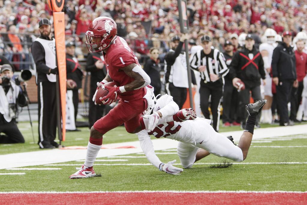 Washington State wide receiver Davontavean Martin, left, runs for a touchdown while pressured by Stanford cornerback Obi Eboh during the first half of an NCAA college football game in Pullman, Wash., Saturday, Nov. 16, 2019. (AP Photo/Young Kwak)