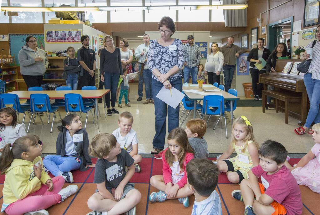 Priesthood Elementary kindergarten teacher Angela Lobsinger greets her new pack of students as parents linger for jut a few minutes more in the background. (Photo by Robbi Pengelly/Index-Tribune)