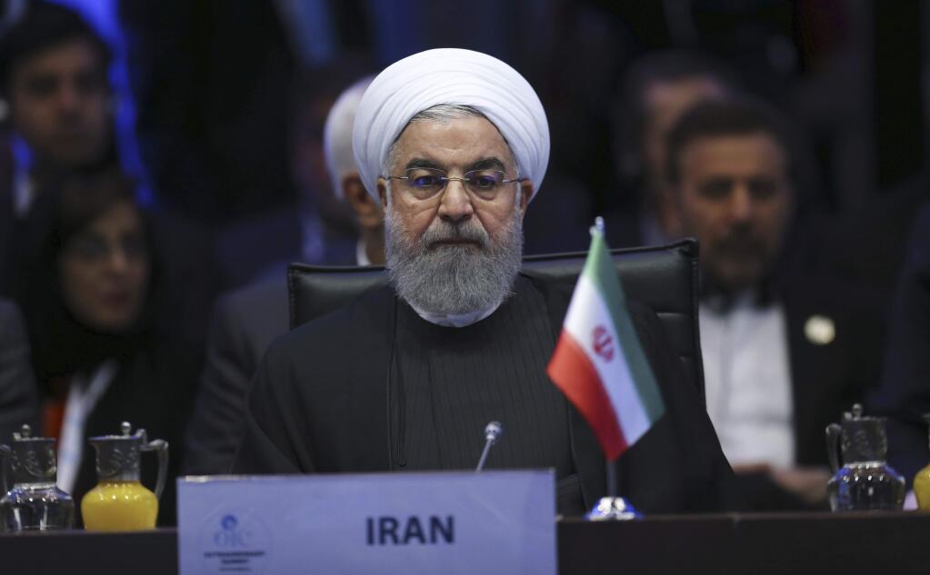 Iran's President Hassan Rouhani attends the Organisation of Islamic Cooperation's Extraordinary Summit in Istanbul, Wednesday, Dec. 13, 2017. Muslim nations of the 57-member Organisation of Islamic Cooperation are rejecting U.S. President Donald Trump's declaration of Jerusalem as the capital of Israel, and appear set to counter it with a declaration of east Jerusalem as the capital of a future Palestinian state. (Emrah Yorulmaz/Pool Photo via AP)