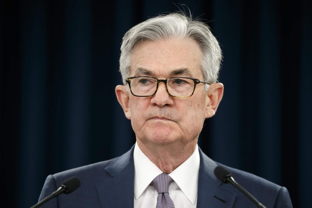 FILE - In this March 3, 2020 file photo, Federal Reserve Chair Jerome Powell pauses during a news conference in Washington. Powell provided a bleak outlook for the U.S. economy in remarks Wednesday, May 13, and urged Congress and the White House to act further to offset the damage from the viral outbreak. (AP Photo/Jacquelyn Martin, File)