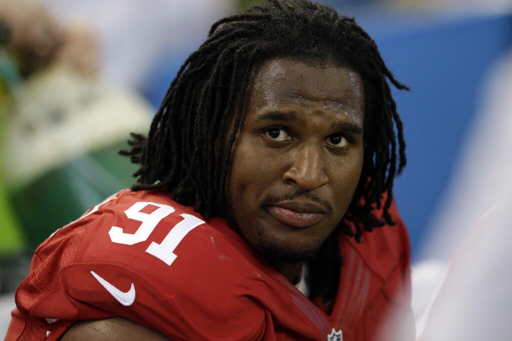 In this Sept. 7, 2014, file photo, San Francisco 49ers' Ray McDonald sits on the bench during the second half of an NFL football game against the Dallas Cowboys in Arlington, Texas. (AP Photo/LM Otero, File)