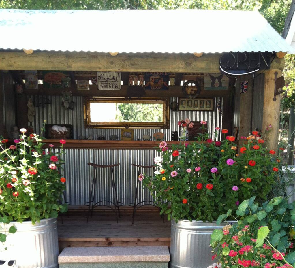 An outdoor bar at the home of Diane Albracht that they built a few years ago to support her 'enormous pig collection.' It is a hit at their parties. (Submitted photo)