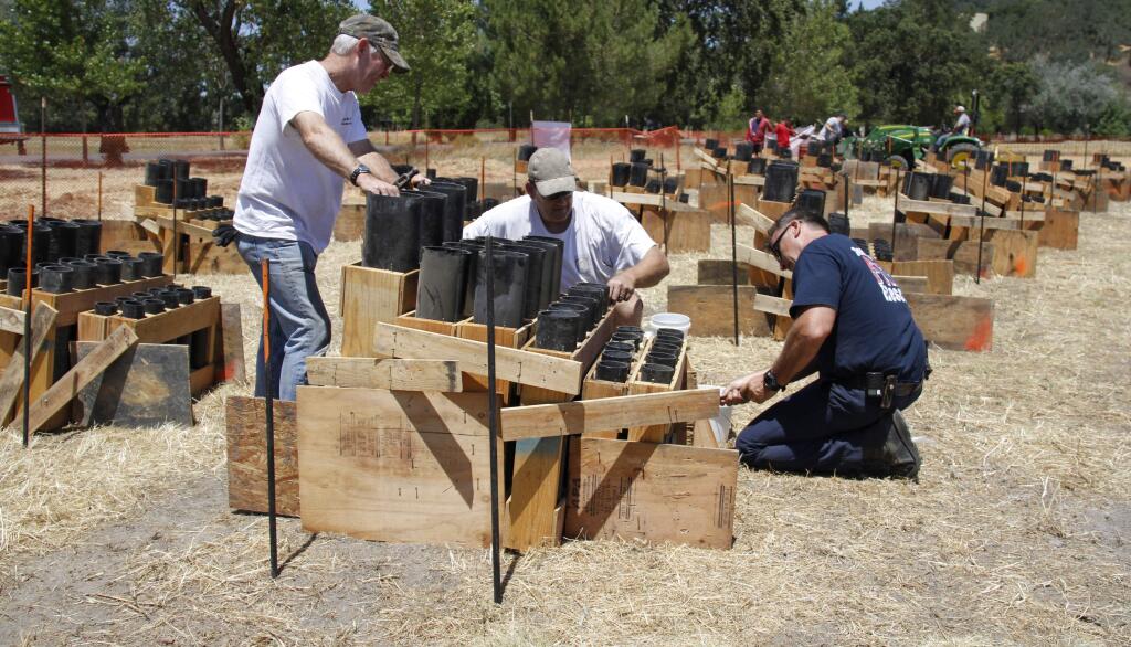 Bill Hoban/Index-Tribune file photoVolunteers from the Sonoma Volunteer Firefighters Association last year set up the tubes in order to shoot off the July 4 fireworks in the field at the Gen. Vallejo Home.