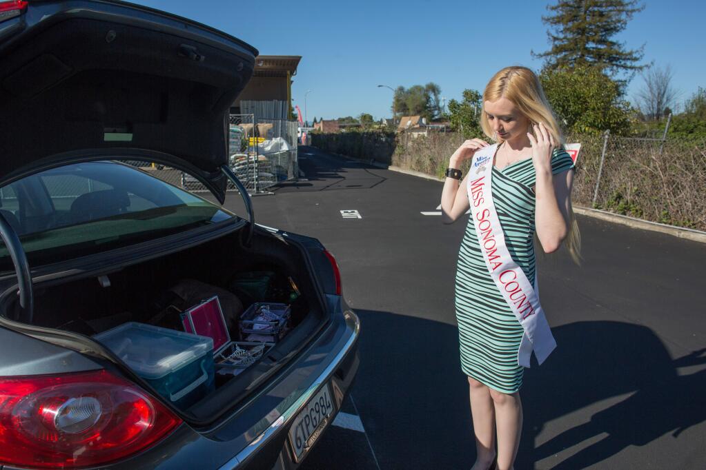 Newly crowned Miss Sonoma County Athena Brattin-Cain, 17, gets ready for an appearance in Santa Rosa Friday, March 27, 2015. Brattin-Cain played lineman for the Elsie Allen High School varsity team, she has signed a contract to become a Marine and she raises hogs. (JEREMY PORTJE/ FOR THE PD)