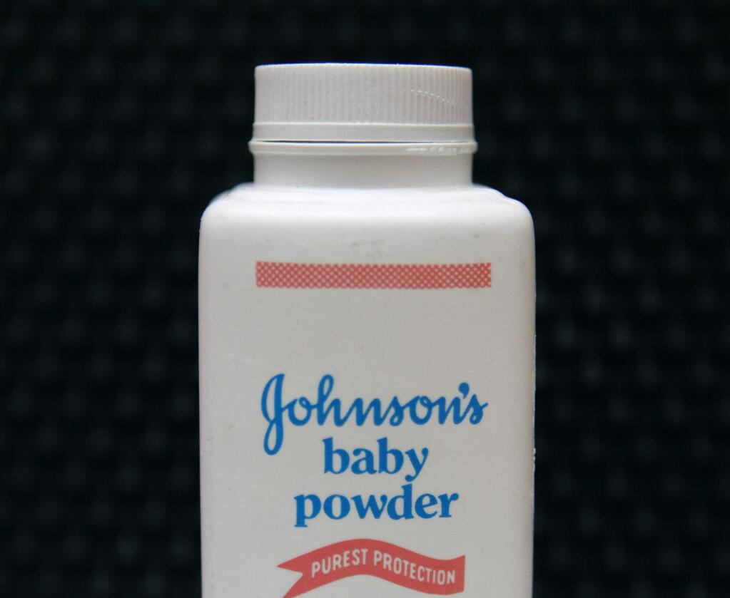 FILE - This April 15, 2011, file photo, shows a bottle of Johnson's baby powder. A Southern California jury has ordered Johnson & Johnson to pay more than $25 million to a woman who claimed in a lawsuit that she developed cancer by using the company's talc-based baby powder. Jurors on Thursday, May 24, 2018, awarded $4 million in punitive damages after finding that Johnson & Johnson acted with 'malice, oppression or fraud.' (AP Photo/Jeff Chiu, File)