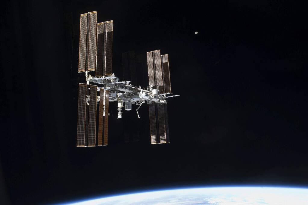 This July 19, 2011 photo of the International Space Station was taken from the space shuttle Atlantis after it left the orbiting complex. NASA ordered up urgent spacewalking repairs at the International Space Station. On Tuesday, May 23, 2017, Americans Peggy Whitson and Jack Fischer will venture out to replace a data relay box that broke over the weekend. (NASA via AP)