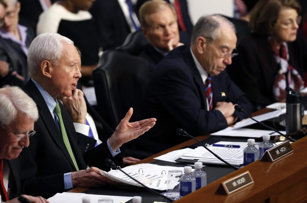 Sen. Orrin Hatch, R-Utah, second from left questions Facebook CEO Mark Zuckerberg during a joint hearing of the Commerce and Judiciary Committees on Capitol Hill in Washington, Tuesday, April 10, 2018, about the use of Facebook data to target American voters in the 2016 election. (AP Photo, Alex Brandon)