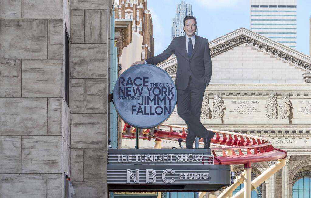 This undated photo made available by Universal Orlando Resort, shows the new 'Race Through New York Starring Jimmy Fallon' ride in Orlando, Fla. Universal is leading the theme-park charge into 'virtual lines' that give visitors options for exploring a park or watching live entertainment instead of the tedium of looking at someone's back as you inch forward step by step to the thrill ride. (Universal Orlando Resort via AP)