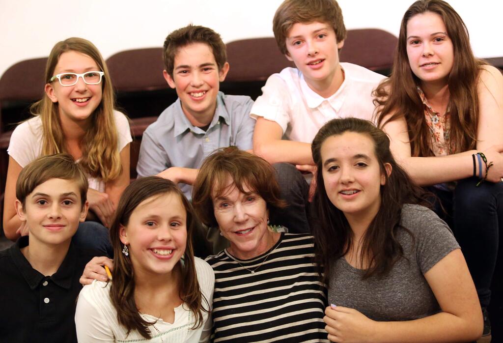 Kathy Eschleman, bottom row second from right, is surrounded by some of the students that participated in The Jim Thrower Rotary Middle School Writers' Faire including top row from left to right, Vivian Cormany, Liam Sheldon ,Ty Brenninger, Simone Raup, bottom row from left to right Christopher Jewell, Sophie Lucchetti, Kathy Eschleman, and Ivy O'Donnell at the Sonoma Community Center, Wednesday, May 20, 2015. (CRISTA JEREMIASON / The Press Democrat)