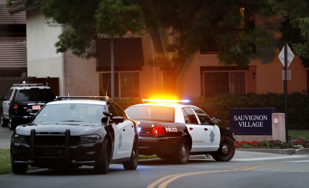 Cotati police officers investigate the scene of a fatal stabbing in the Alicante housing area of Sauvignon Village on the Sonoma State University campus in Rohnert Park on Sunday, May 13, 2018. (BETH SCHLANKER/ PD)