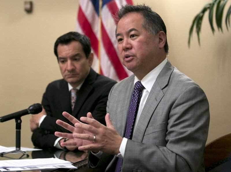 In this June 13, 2017, file photo, Assemblyman Phil Ting, D-San Francisco, right, discusses the state budget in Sacramento. In 2016, Gov. Jerry Brown vetoed a bill by Ting that would have expanded the list of those who can seek gun violence restraining orders to include, among others, employees of high schools and colleges. The school shooting in Parkland, Fla., Feb. 14, that killed at least 17 people, has revived the debate about red flag laws. Ting said he plans to reintroduce the bill. (AP Photo/Rich Pedroncelli,File)