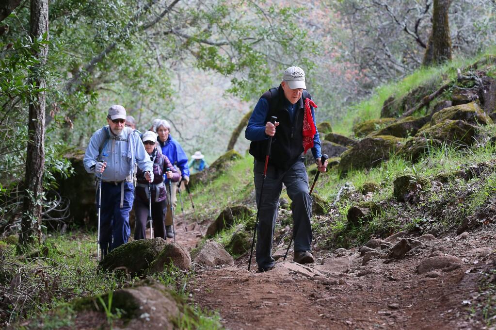 Dave Chalk, right, hikes with a social hiking group in Trione-Annadel State Park, in Santa Rosa on Tuesday, March 19, 2019. Chalk, along with Bill Myers, leads Bill & Dave Hikes, and the duo are looking for successors to continue their popular local hiking excursions.in Santa Rosa on Tuesday, March 19, 2019. (Christopher Chung/ The Press Democrat)