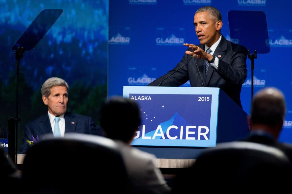 President Barack Obama, accompanied by Secretary of State John Kerry, left, gives remarks at the Global Leadership in the Arctic: Cooperation, Innovation, Engagement and Resilience (GLACIER) Conference at Denaina Civic and Convention Center in Anchorage, Alaska, Monday, Aug. 31, 2015. Obama opened a three-day trip to Alaska aimed at showing solidarity with a state often overlooked by Washington, while using its changing landscape as an urgent call to action on climate change. (AP Photo/Andrew Harnik)