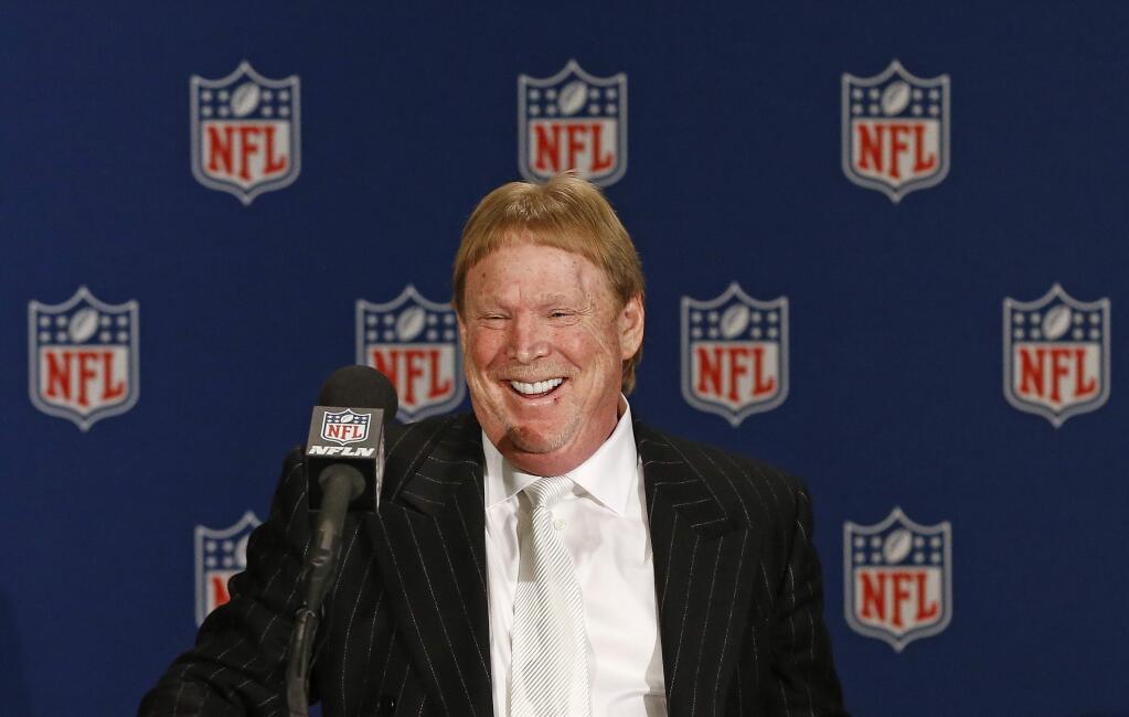Oakland Raiders owner Mark Davis smiles as he steps up to the podium during a news conference after NFL football owners approved the move of the Raiders to Las Vegas in a 31-1 vote at the NFL meetings Monday, March 27, 2017, in Phoenix. (AP Photo/Ross D. Franklin)
