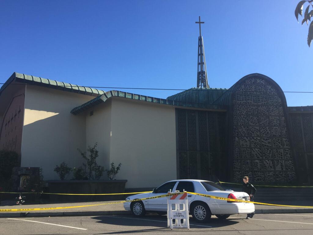 Police cordoned off St. John's Catholic Church on Matheson Street in Healdsburg as they investigate the death of a child on Sunday, Nov. 20, 2016. (BETH SCHLANKER/ PD)