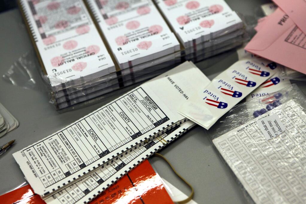 Ballots and election supplies sit on a table at Miwok Valley Elementary School in Petaluma, California on Tuesday, November 6, 2012. (BETH SCHLANKER/ The Press Democrat)