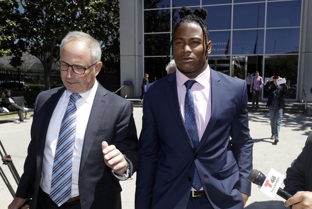San Francisco 49ers linebacker Reuben Foster, right, leaves the Santa Clara County Superior Court with his attorney Joshua Bentley after a preliminary hearing stemming from domestic violence accusations against Foster Thursday, May 17, 2018, in San Jose. (AP Photo/Marcio Jose Sanchez)