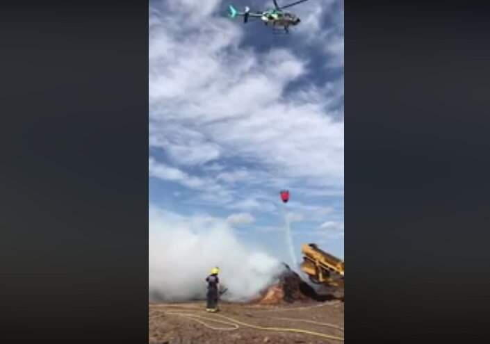 In a screenshot from video posted to the Sonoma County Sheriff's Office Facebook page, Henry 1 helps extinguish a fire near the Sonoma County airport on Sunday, April 19, 2020. (Sonoma County Sheriff's Office)
