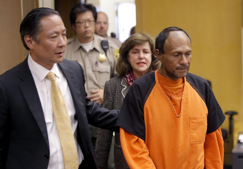 Francisco Sanchez, right, is lead into the courtroom by San Francisco Public Defender Jeff Adachi, left, and Assistant District Attorney Diana Garciaor, center, for his arraignment at the Hall of Justice on Tuesday, July 7, 2015 in San Francisco. Prosecutors have charged the Mexican immigrant with murder in the waterfront shooting death of 32-year-old Kathryn Steinle. (Michael Macor/San Francisco Chronicle via AP, Pool)