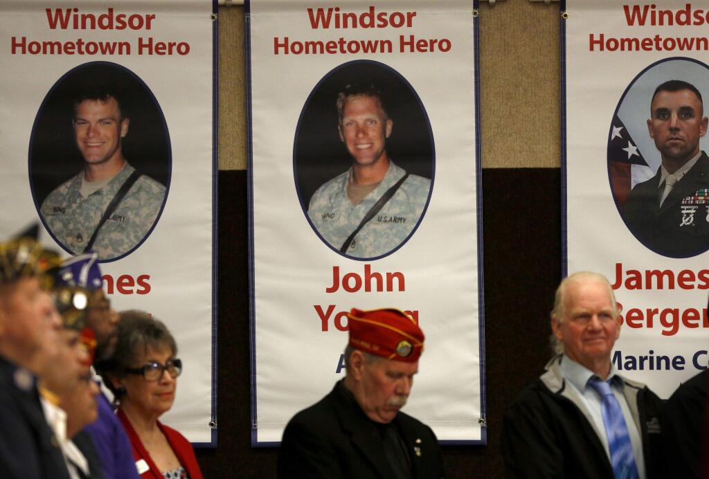Banners hang in the Huerta Gymnasium during the Windsor Hometown Heroes Military Banner Program's ceremony on Sunday, January 11, 2015 in Windsor, California . (BETH SCHLANKER/ The Press Democrat)