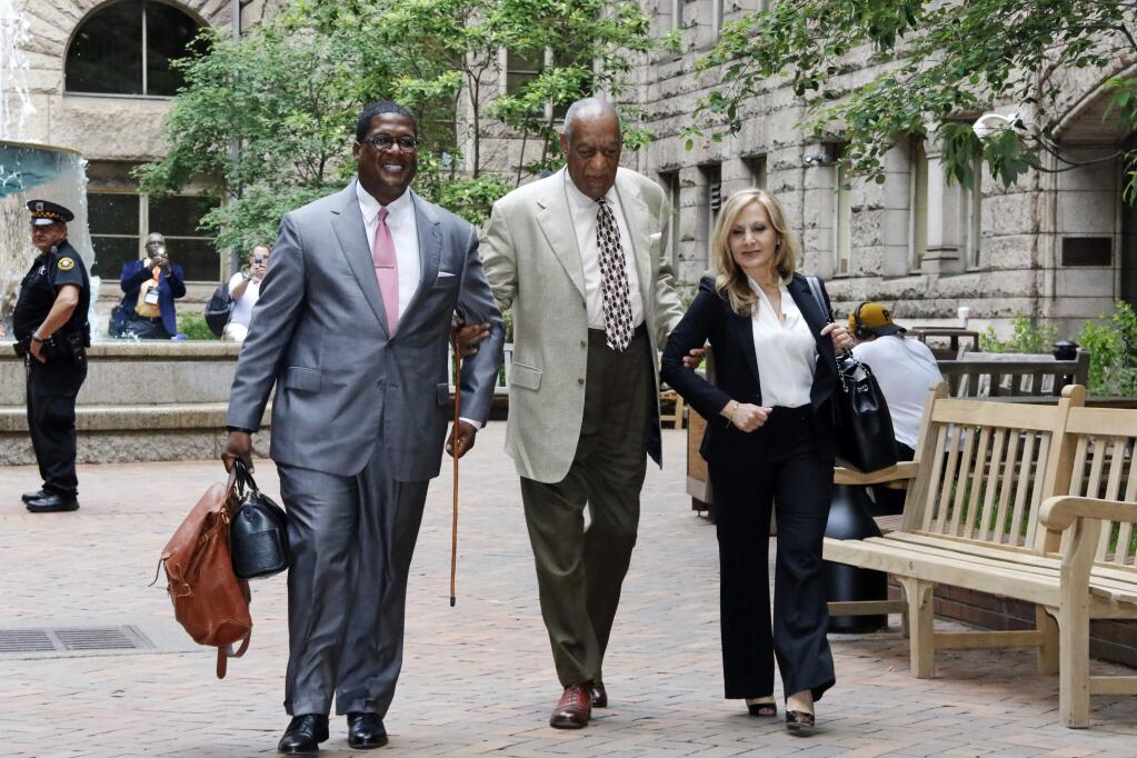 Bill Cosby, center, arrives with one of his attorneys Angela Agrusa, right, for the second day of jury selection in his sexual assault case at the Allegheny County Courthouse, Tuesday, May 23, 2017, in Pittsburgh. The case is set for trial June 5 in suburban Philadelphia. (AP Photo/Gene J. Puskar)