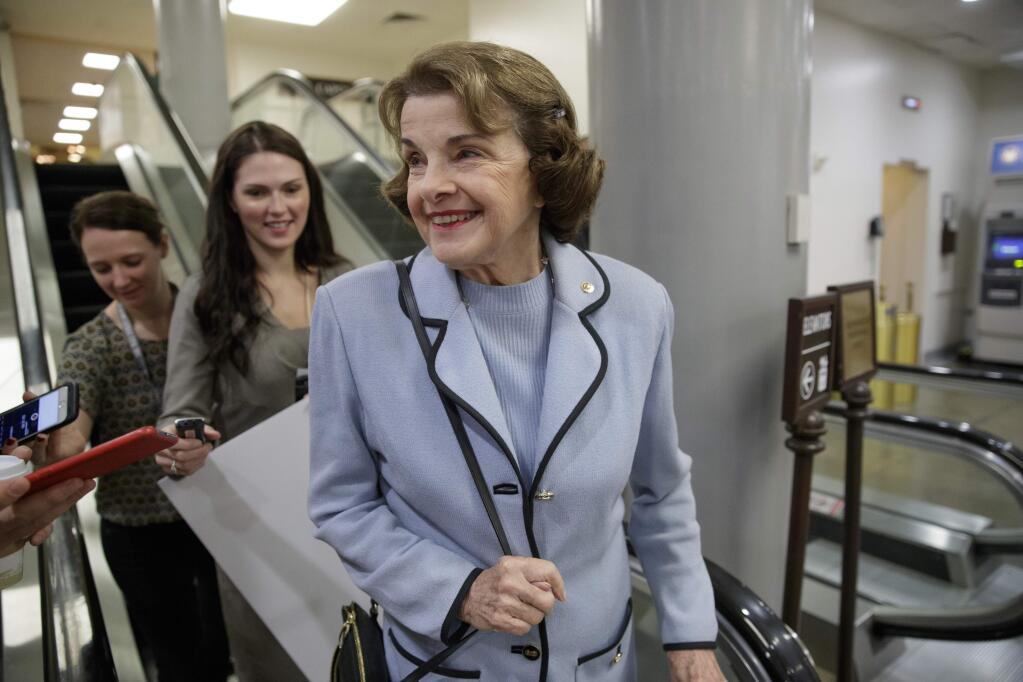 Sen. Dianne Feinstein, D-Calif., the ranking member on the Senate Judiciary Committee, is questioned by reporters at the Capitol in Washington, Wednesday, Oct. 25, 2017. (AP Photo/J. Scott Applewhite)