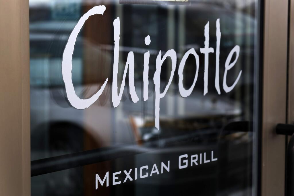 The owners of Chipotle Mexican Grill said the restaurant chain has completed phasing out genetically modified ingredients from its food. (J. PUSKAR / Associated Press)