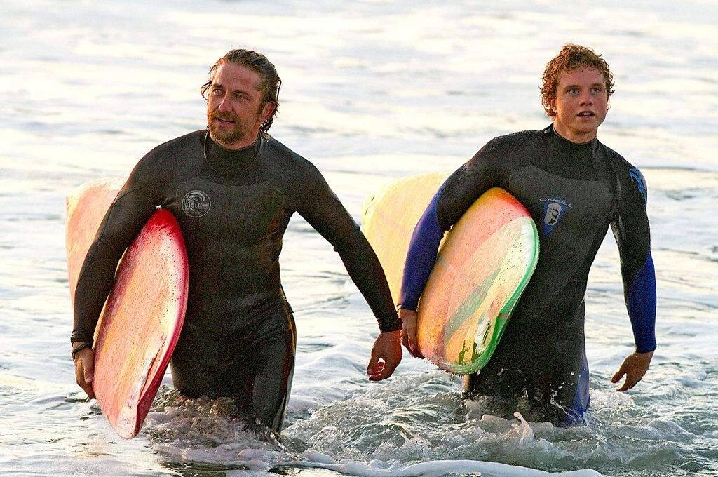 Gerard Butler, left, plays Frosty Hesson and Jonny Weston is Jay Moriarty, who died in 2001 in an apparent diving accident.
