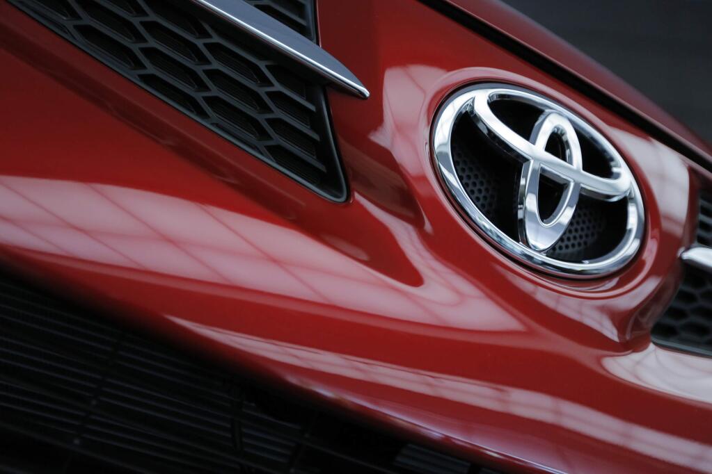 In this Wednesday, May 8, 2013 file photo, a Toyota Motor Corp.,'s model is on display at the automaker's Tokyo head office in Tokyo. (AP Photo/Itsuo Inouye, File)