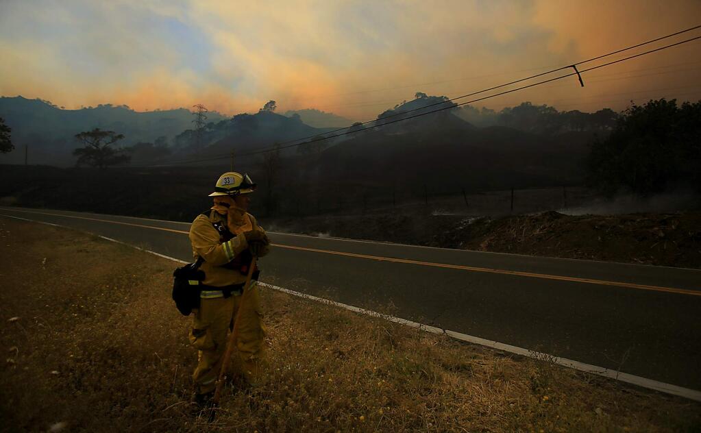 Firefighters keep close watch on unburned grass as the Cold fire near Lake Berryessa advances on Tuesday Aug. 2, 2016. (KENT PORTER/ PD)