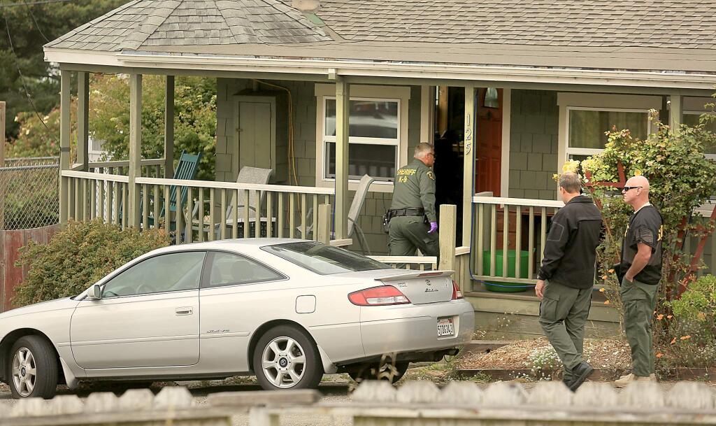 Sonoma County sheriff's detectives remain at the scene of a home on Taylor Street in Bodega Bay where a shooting was reported on Friday, July 31, 2015. (KENT PORTER/ PD)