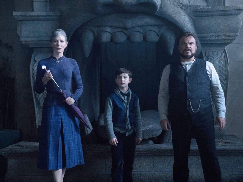 Cate Blanchett as Mrs. Zimmerman, Owen Vaccaro as Lewis Barnavelt and Jack Black as Jonathan Barnavelt star in 'The House with a Clock in Its Walls,' based on the 1973 young adult fantasy novel. (Universal Pictures)