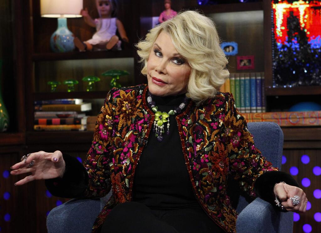 An exchange between comedian Joan Rivers and a Wisconsin heckler illustrates America's culture of outrage.