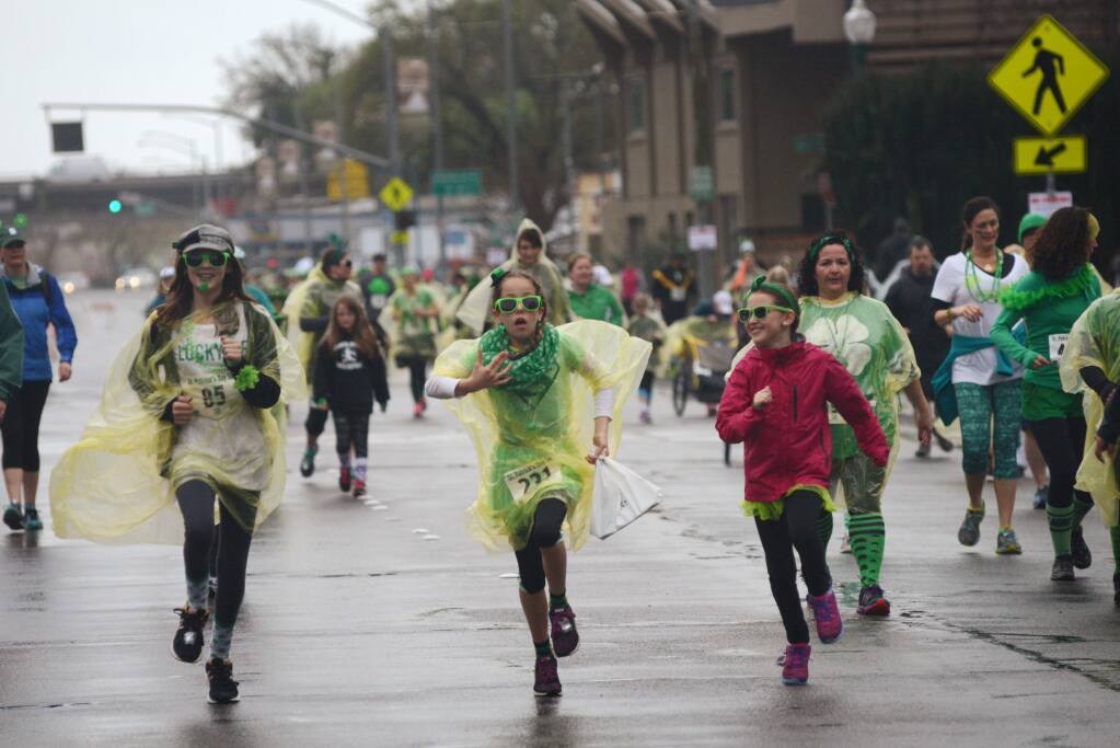 Runners heading north on Santa Rosa Avenue during the St. Patrick's Day 5K run held at Juilliard Park in downtown Santa Rosa Sunday. Proceeds from the race benefit the Santa Rosa Recreation & Parks Scholarship Fund. March 13, 2016. (Photo: Erik Castro/for The Press Democrat)