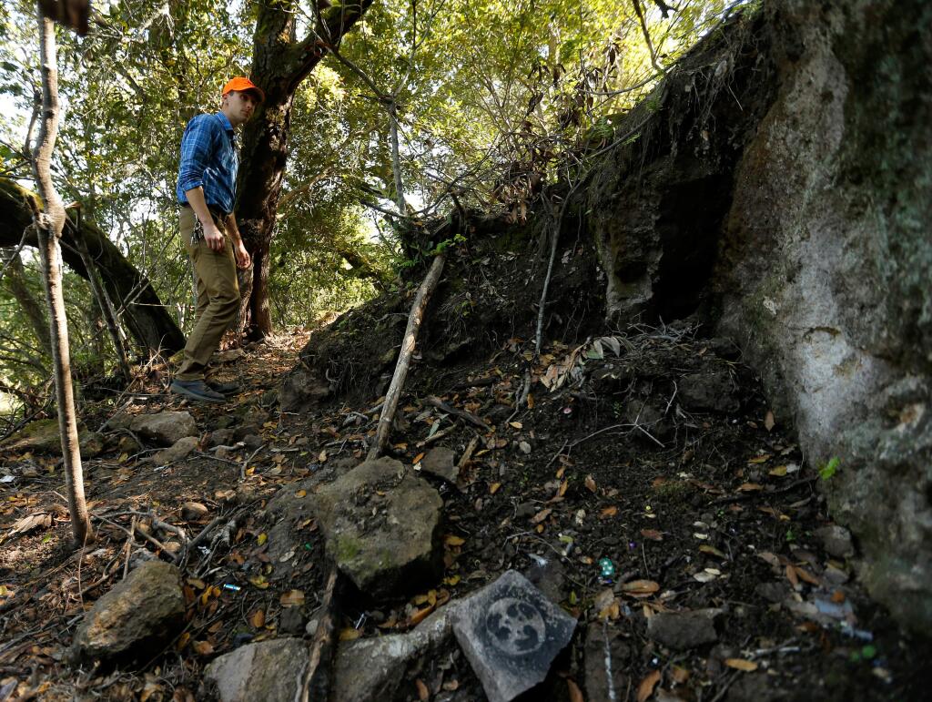 Stormwater compliance specialist Chris Pegg of Sonoma Public Works walks through the site of a former homeless encampment that he helped clear in February at Montini Open Space Preserve in Sonoma, California on Friday, March 25, 2016. (Alvin Jornada / The Press Democrat)