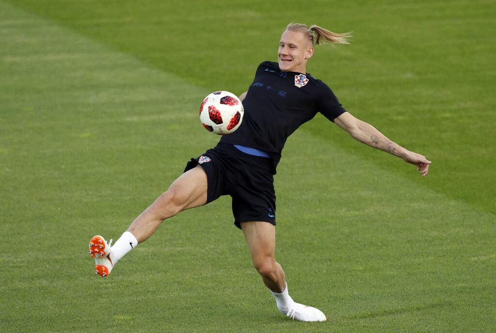 Croatia's Domagoj Vida kicks the ball during a training session of the Croatian national team at the 2018 World Cup in Moscow, Russia, Friday, July 13, 2018. (AP Photo/Darko Bandic)