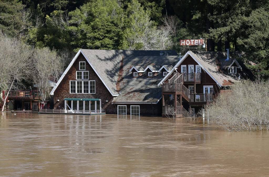 Water from the Russian River surrounds Highland Dell Lodge in Monte Rio on Thursday, February 28, 2019. (Christopher Chung / The Press Democrat)